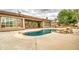 Inviting backyard featuring a rock-accented pool and covered patio area at 4417 W Lawler Loop, Phoenix, AZ 85083