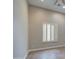 Neutral room featuring tile floors, light gray walls, and bright, natural light from the window at 4417 W Lawler Loop, Phoenix, AZ 85083