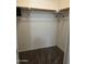 Walk-in closet with carpeted floors and a simple rod for organized storage at 4546 N 84Th Ln, Phoenix, AZ 85037