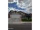 Well-manicured front yard of a single-Gathering home with a large two-car garage at 4546 N 84Th Ln, Phoenix, AZ 85037