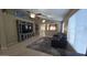 Inviting living room features tile flooring, large TV, and an open floor plan perfect for entertaining at 4546 N 84Th Ln, Phoenix, AZ 85037