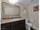 Cozy bathroom featuring vanity, sink, mirror and ample lighting, plus neutral color palette at 5045 E Redfield Rd, Scottsdale, AZ 85254