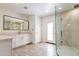 Bright bathroom with dual vanity, glass shower, and modern fixtures; stylish and functional at 5045 E Redfield Rd, Scottsdale, AZ 85254