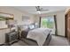 Bedroom with neutral walls, ceiling fan and large window with a view at 5045 E Redfield Rd, Scottsdale, AZ 85254