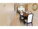 Formal dining room with plenty of natural light, an elegant table and seating for six at 5045 E Redfield Rd, Scottsdale, AZ 85254