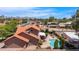 Beautiful exterior view featuring a pool, patio and well-maintained landscaping at 5045 E Redfield Rd, Scottsdale, AZ 85254