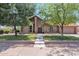 Charming home featuring mature trees, a manicured lawn, and a welcoming front entrance at 5045 E Redfield Rd, Scottsdale, AZ 85254