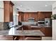 Spacious kitchen with stainless steel appliances, custom cabinets, and a mosaic tile backsplash at 5045 E Redfield Rd, Scottsdale, AZ 85254