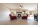 Spacious living room featuring a brick fireplace and plenty of natural light through large windows at 5045 E Redfield Rd, Scottsdale, AZ 85254