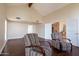 Hardwood floors and vaulted ceiling make for a bright living room with plenty of natural light at 5045 E Redfield Rd, Scottsdale, AZ 85254