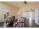 Bright living room featuring hardwood floors, vaulted ceiling, and ample windows for natural light at 5045 E Redfield Rd, Scottsdale, AZ 85254