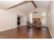 Bright living room features vaulted ceilings, dark wood floors, fireplace, and double doors at 5045 E Redfield Rd, Scottsdale, AZ 85254