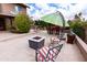 Cozy patio space with outdoor seating, a fire pit, and lush landscaping, creating a relaxing outdoor retreat at 5045 E Redfield Rd, Scottsdale, AZ 85254