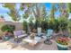 Outdoor seating area with a quaint fountain, comfortable seating, and lush landscaping at 5045 E Redfield Rd, Scottsdale, AZ 85254