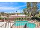 Inviting backyard oasis with a sparkling pool, mature trees, and outdoor seating at 5045 E Redfield Rd, Scottsdale, AZ 85254