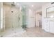 Luxurious glass shower with rainfall showerhead and built-in bench in a spa-like bathroom at 5045 E Redfield Rd, Scottsdale, AZ 85254