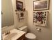 Well-appointed half-bathroom with stylish decor, offering convenience and charm for guests at 5518 E Lindstrom Ln # 3010, Mesa, AZ 85215