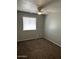 Bedroom with a window and ceiling fan and carpeted flooring at 7126 N 19Th Ave # 103, Phoenix, AZ 85021