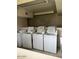 A communal laundry room with several coin-operated washing machines at 7126 N 19Th Ave # 103, Phoenix, AZ 85021