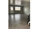 Spacious living room with gray walls and laminate flooring at 7126 N 19Th Ave # 103, Phoenix, AZ 85021