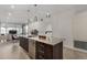 Kitchen island boasts granite countertops, stainless appliances and decorative pendant lights at 7180 E Kierland Blvd # 312, Scottsdale, AZ 85254