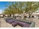 Comfortable outdoor lounge area with plush seating, mature trees, and beautiful views, perfect for socializing at 7180 E Kierland Blvd # 312, Scottsdale, AZ 85254