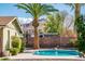 Desert backyard featuring a swimming pool, block wall and mountain views at 725 E Country Gables Dr, Phoenix, AZ 85022