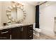 Bathroom with granite countertop, modern vanity, and shower/tub combination at 725 E Country Gables Dr, Phoenix, AZ 85022