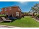 Spacious backyard showcasing artificial turf, outdoor seating, and a pergola, ideal for relaxation at 7252 N 90Th Ln, Glendale, AZ 85305