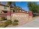 Stone community entrance sign for Provence featuring lush desert landscaping and community homes at 7252 N 90Th Ln, Glendale, AZ 85305