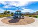 Community playground with swings, slides, and climbing structures surrounded by lush landscaping at 7252 N 90Th Ln, Glendale, AZ 85305