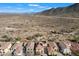 Aerial view of homes in a desert landscape, showcasing community and nearby mountains at 7428 W Montgomery Rd, Peoria, AZ 85383