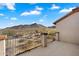 Balcony with a metal guardrail overlooking the desert landscape and distant mountains at 7428 W Montgomery Rd, Peoria, AZ 85383