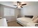 Bright bedroom with modern fixtures, plush bedding, and a ceiling fan at 7428 W Montgomery Rd, Peoria, AZ 85383