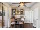 Cozy dining area next to the kitchen featuring modern furnishings, custom cabinets, and natural light at 7428 W Montgomery Rd, Peoria, AZ 85383