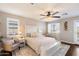 Spacious main bedroom with ceiling fan, natural light, and cozy decor at 7428 W Montgomery Rd, Peoria, AZ 85383