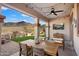 Covered patio with mountain views, ceiling fan, outdoor seating and a TV at 7428 W Montgomery Rd, Peoria, AZ 85383