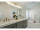 Modern bathroom with double vanity, granite counter-tops, and luxury tiling at 7543 E Keats Ave, Mesa, AZ 85209