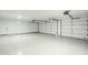 Spacious two car garage featuring epoxy flooring, and two garage door openers at 7543 E Keats Ave, Mesa, AZ 85209