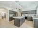 Kitchen showcasing an island, modern appliances, and a sleek design with ample cabinet space at 7543 E Keats Ave, Mesa, AZ 85209