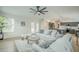 Inviting living room open to the kitchen with bright natural light and neutral tones at 7543 E Keats Ave, Mesa, AZ 85209