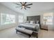 Spacious main bedroom with carpet, fan, neutral tones, and lots of natural light at 7543 E Keats Ave, Mesa, AZ 85209