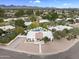 Expansive aerial view of a property featuring a pool, complemented by lush landscaping and scenic mountain views at 8405 N Via Mia --, Scottsdale, AZ 85258