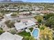 Aerial view showcases house, pool, landscaping in a suburban neighborhood near golf course and mountains at 8405 N Via Mia --, Scottsdale, AZ 85258