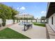 Backyard view showcasing a swimming pool, artificial turf, patio dining set and patio furniture at 8405 N Via Mia --, Scottsdale, AZ 85258