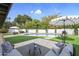 Inviting backyard featuring a pool, well-manicured lawn, and comfortable patio seating area under a white umbrella at 8405 N Via Mia --, Scottsdale, AZ 85258