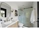 Bright bathroom featuring floating vanity, statement mirror, modern fixtures, and glass shower with tile surround at 8405 N Via Mia --, Scottsdale, AZ 85258