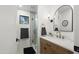 Stylish bathroom featuring wood vanity with marble countertop and glass-enclosed shower, creating a spa-like retreat at 8405 N Via Mia --, Scottsdale, AZ 85258