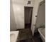 Bathroom featuring tile floors, vintage fixtures and adjacent doorway at 8727 N 35Th Dr, Phoenix, AZ 85051