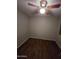 Cozy bedroom featuring a ceiling fan and durable vinyl wood floors at 8727 N 35Th Dr, Phoenix, AZ 85051